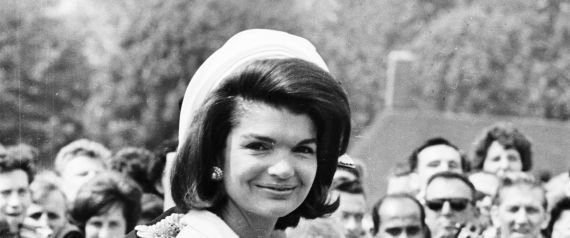 15th May 1965:  Jacqueline Kennedy (1929 - 1994) attends the inauguration of a memorial to her husband John F. Kennedy in Runnymede, Surrey, nearly eighteen months after his assassination. Holding her hand is her young son, John F. Kennedy Jr. (1960 - 1999).  (Photo by Michael Stroud/Express/Getty Images)