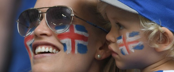 An Iceland's supporter and her child are pictured ahead of the Euro 2016 group F football match between Iceland and Hungary at the Stade Velodrome in Marseille on June 18, 2016. / AFP / BORIS HORVAT        (Photo credit should read BORIS HORVAT/AFP/Getty Images)